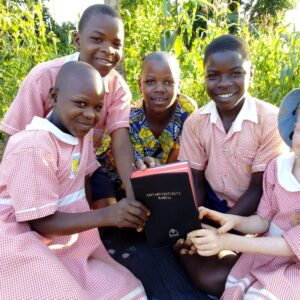 Children holding a bible