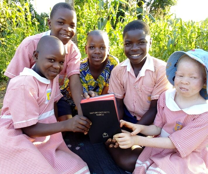 The Family of Fatinah receiving a Bible